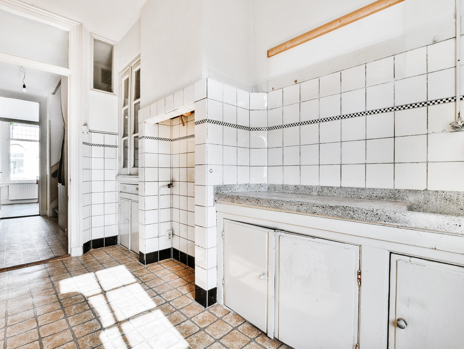 Outdated kitchen wall tiles before remodeling in Los Angeles